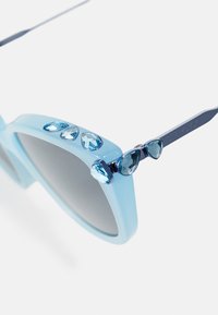 Swarovski Akiniai nuo saulės - light blue