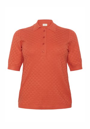 Rövidujjú pólóing korall színben, texturált gyémánt mintával, három gombos gombolással, valamint bordás gallérral és mandzsettával.