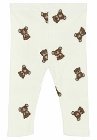 Hvide ribbede leggings med et gentaget mønster af brune teddybjørne, med detaljerede ansigtstræk og en blød tekstur.