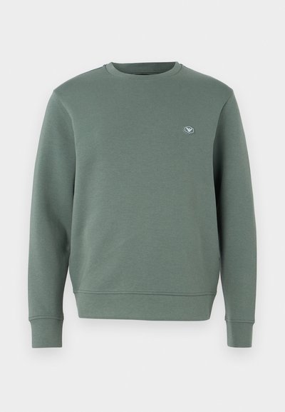 Πράσινη μπλούζα από μαλακό φλις, με στρογγυλή λαιμόκοψη, μακριά μανίκια, ριμπ μανσέτες και ένα μικρό λογότυπο στο στήθος.