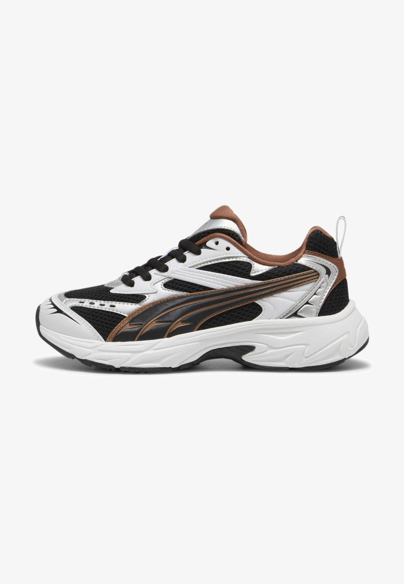 Black and white athletic shoes with mesh sides, reflective silver accents, and brown details. Features a textured sole and lace-up design.