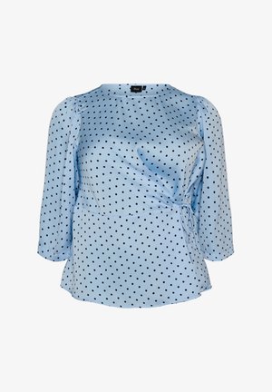 Blouse bleu clair à pois noirs, manches trois-quarts, avec un détail de nouage sur le côté, en tissu texturé.