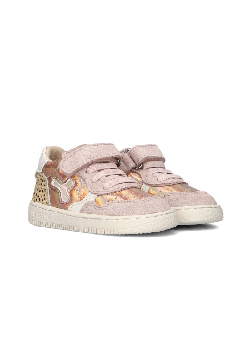 Light pink sneakers featuring a velcro strap, suede and metallic textures, decorative perforations, and a white rubber sole.