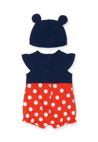 Romper rouge et bleu marine avec des pois blancs, des manches volantées et des fermetures à boutons pression au dos. Accompagné d'un chapeau bleu marine avec des oreilles d'ours.