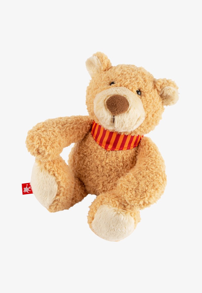 Ours en peluche avec une fourrure douce et duveteuse de couleur beige, des accents crème sur les pattes et le museau, portant un collier à rayures rouges. Étiquette de jouet attachée.