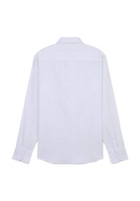 Chemise blanche à manches longues avec un motif texturé subtil, un col, des poignets à boutons et un ourlet droit. La vue de dos ne montre aucune marque visible.