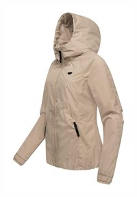 Light beige jacket with a hood, zippered front, elastic cuffs, and two zippered side pockets. Smooth texture, functional design.