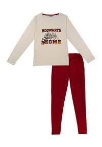 Maglietta a maniche lunghe di colore crema con grafica "Hogwarts HOME" e leggins rossi. Tessuto morbido, vestibilità rilassata, con scollatura rotonda e vita elastica.