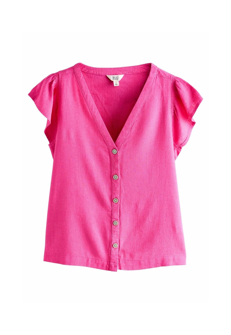 Blouse rose vif à manches courtes avec col en V et cinq boutons devant, en tissu léger.
