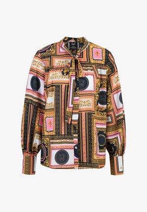 Long-sleeve blouse in silky fabric, featuring a geometric pattern of gold, pink, black, and white with tie-neck detail and buttoned cuffs.