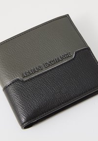 Black and gray bi-fold wallet made of textured PU leather, featuring a logo, contrasting stitching, and a sleek design.