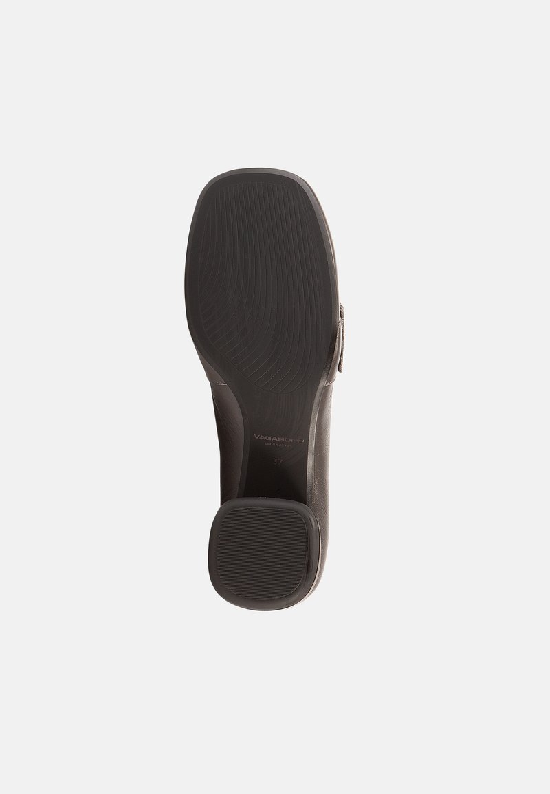 Black leather shoe sole featuring textured grip lines, rounded toe, and a small raised heel. Stamped logo and size details visible.
