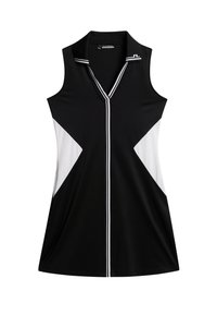 Svart ärmlös klänning med vita och svarta triangulära färgblock. Har en V-ringning och vita accentremsor längs knappraden.