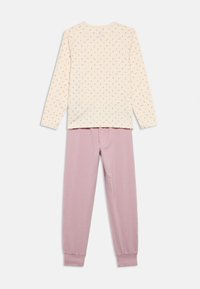 Light beige long-sleeve top with a floral pattern; paired with pink cuffed pajama pants. Both pieces are made of soft, breathable fabric.