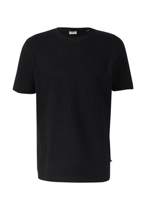 T-shirt noir à manches courtes avec col rond et une petite étiquette blanche cousue à l’encolure, à l’intérieur du col.