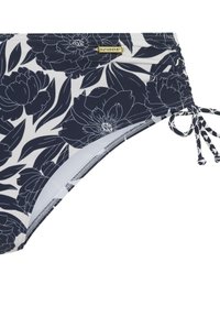 Laatikko ja valkoinen kukallinen bikinitoppi, jossa on rypytettyjä sivuja ja solmittavat kiinnitykset. Ominaisuuksiin kuuluu pieni kultainen "sunseeker" logo. Pehmeä, joustava kangas.