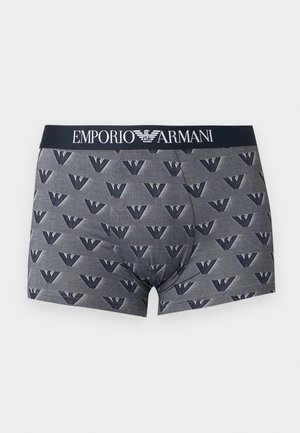 Γκρι ανδρικά σλιπ boxer με επαναλαμβανόμενο μοτίβο του αετού Emporio Armani και μαύρη ζώνη μέσης με λευκή επιγραφή και λογότυπο Emporio Armani.