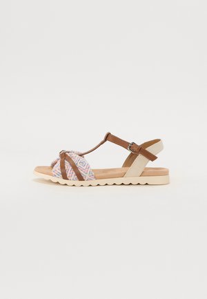 Multi-color fabric upper with brown and beige straps, featuring a flat sole with a wave pattern. Adjustable buckle for a secure fit.