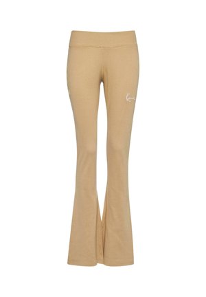 Beige, utsvingte yogabukser med bredt elastisk liv, laget av mykt stoff, med en liten hvit logo på venstre hofte.