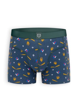 Boxer blu navy con una cintura verde decorata con un divertente motivo di guanti da baseball, palline e mazze nei colori giallo, rosso e bianco.