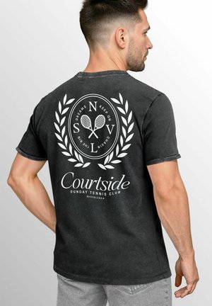 Black short-sleeve t-shirt featuring a white circular tennis club graphic with laurel accents and text on the back.