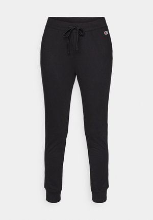 Sorte joggebukser laget av mykt stoff, med justerbar snor i livet og ribbede mansjetter for en tett passform. Logoer på siden.