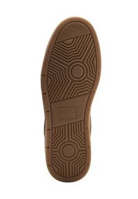 Rubber shoe sole with circular and zigzag patterns, featuring a central circular design and a rectangular MNG logo. Color: tan.