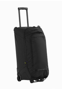 Zwarte koffer met wielen en een textuur aan de buitenkant, ritscompartimenten, uitschuifbare handgreep en stevige wielen voor mobiliteit.