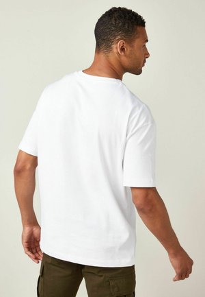 HEAVYWEIGHT - Basic T-shirt - white