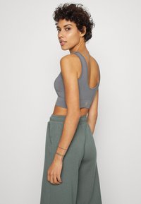 Yogasearcher HADU SEAMLESS BRA - Sutiã desportivo de suporte ligeiro - lavastone