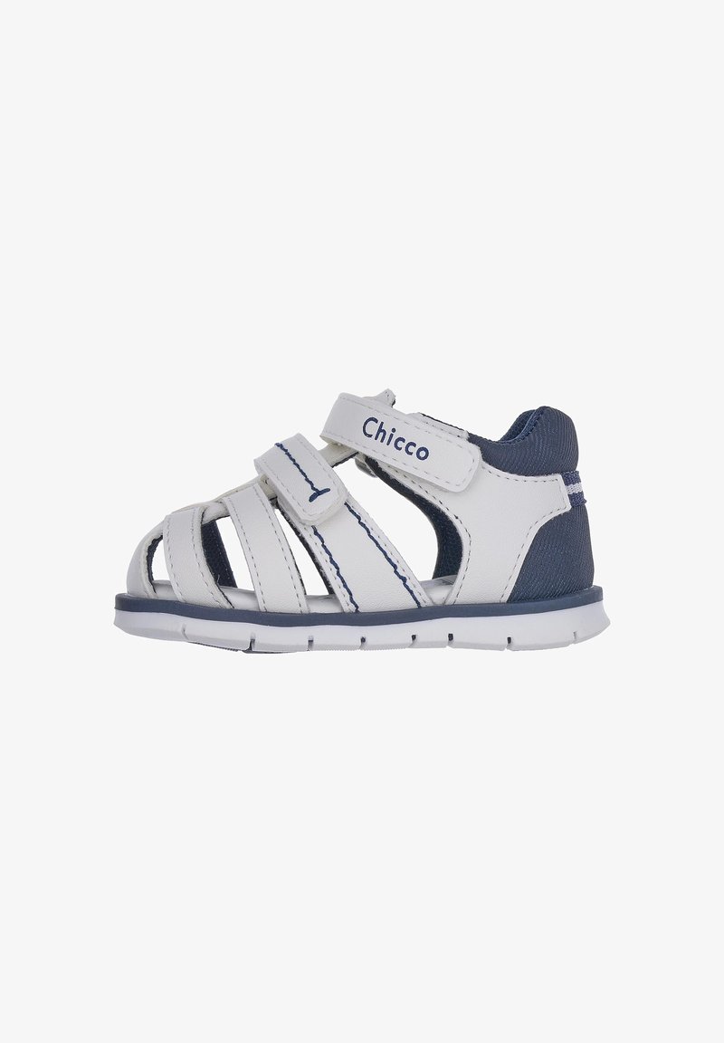 White leather sandal with blue accents, an open design, adjustable Velcro straps, and a flexible rubber sole for comfort and support.