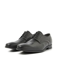 Zwarte leren dresschoenen met een gladde afwerking, puntige neus, veters en een lage hak. Eenvoudig design, geen zichtbare patronen of accenten.