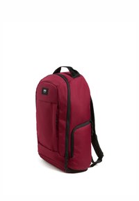 Maroon backpack with a smooth, textured fabric. Features a front zippered pocket, black accents, and adjustable shoulder straps.