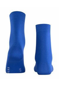 Calzini blu al ginocchio con una texture liscia, bordo a costine e tallone rinforzato. Branding sottile vicino alla caviglia in bianco.