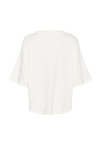 Hvid kortærmet top med en løs pasform, der har et diskret prikket mønster på stoffet. Blød tekstur, rund kant og afslappede ærmer.