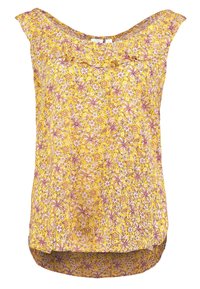 Blommig linne i gult tyg med rundad halsringning, volangdetaljer och ett mönster av rosa och vita blommor över hela. Rundad fåll.