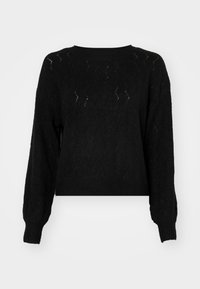 Svart stickad tröja med en kortad design, som har ett texturerat diamantmönster och ribbade muddar och fåll. Långa, något puffiga ärmar.