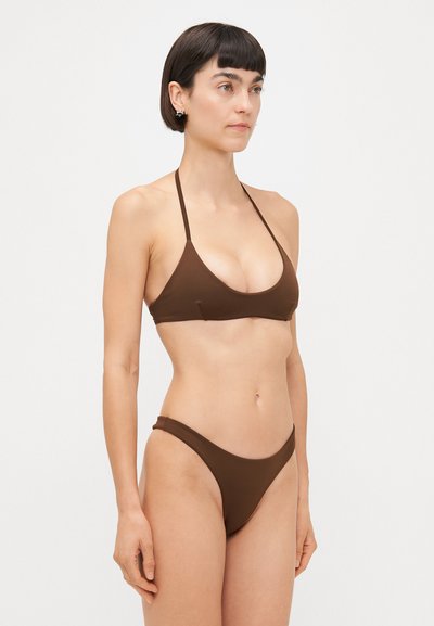 Brown bikini set featuring a triangular top with thin straps and matching low-rise bottoms, both in a smooth, stretchy fabric.