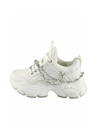 White sneaker with thick sole, textured fabric, and eyelet lacing system. Accented with silver chain and bead detail wrapped around the side.