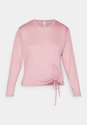 Langermet rosa topp laget av mykt stoff, med en samling ved midjen med justerbare snorer og rund halslinning.