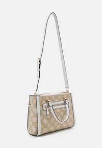 Beige handbag with white logo pattern, white accents, gold hardware, and a detachable shoulder strap. Structured shape, decorative zipper.
