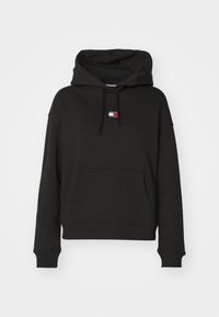 Sweat à capuche noir en tissu mélangé de coton, doté d'une poche avant, d'une capuche à cordon de serrage et d'un petit écusson logo sur la poitrine.