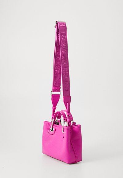 Bright pink leather handbag with a wide adjustable shoulder strap embossed with the Emporio Armani logo in matching color.