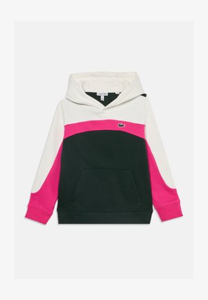 Sweat à capuche avec des blocs de couleurs blanc, rose et vert foncé, poche kangourou à l'avant et petit logo crocodile vert sur la poitrine.