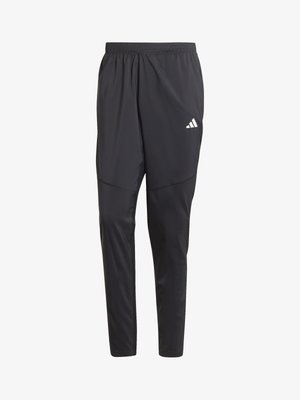 Black athletic pants made of lightweight material, featuring an elastic waistband and tapered legs. Notable white brand logo on the thigh.