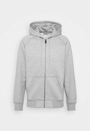 Hellgraue Zip-Hoodie aus weichem Stoff, mit Kapuze zum Schneiden, Kängurutaschen und gerippten Bündchen, versehen mit einem Logo-Detail.