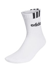Calcetín deportivo blanco con textura acanalada, que presenta el logo negro de Adidas y tres rayas negras en la parte superior. Diseño de longitud media, hasta la pantorrilla.