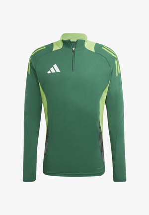 T-shirt de sport vert avec fermeture éclair quart, panneaux latéraux contrastants en vert clair, accents noirs et logo blanc sur la poitrine gauche.