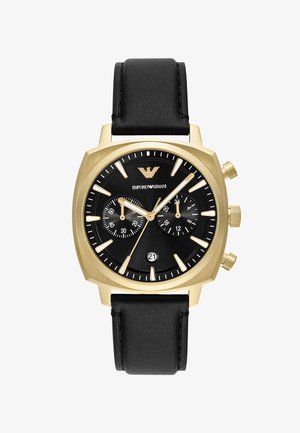 Reloj cronógrafo en tono dorado con esfera negra. Cuenta con correa de cuero negra, 3 subesferas, indicador de fecha y marcadores de hora en contraste.