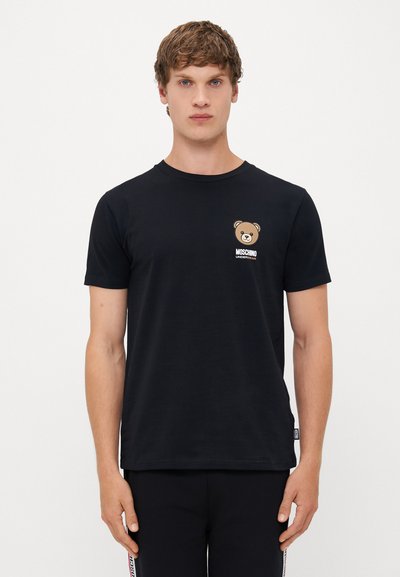 T-shirt en coton noir avec un col rond, des manches courtes et un graphique d'ours sur la poitrine avec le texte "MOSCHINO UNDERWEAR" en dessous.